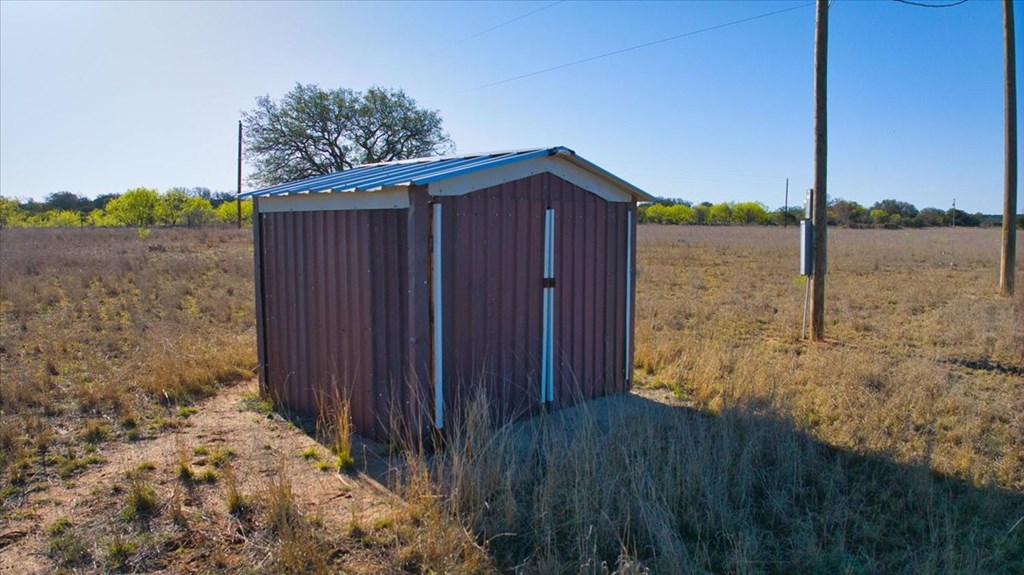 362 Jacoby Lane Hext, TX 76848 - Photo 16 of 36 a view of backyard with wooden fence
