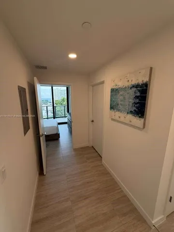 a living room with furniture and a chair