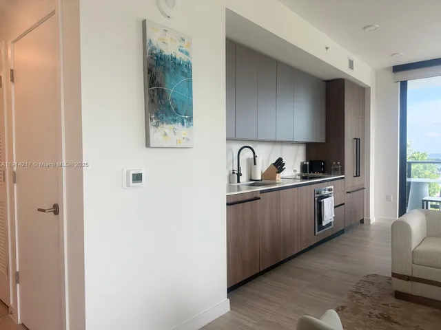 a bedroom with a bed and a rug