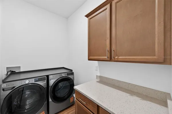 a view of an empty room with storage