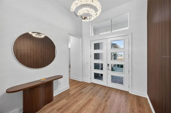 a view of a livingroom with furniture and wooden floor