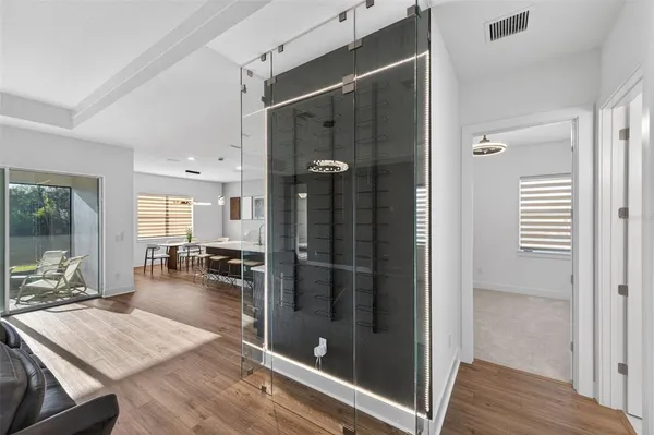 a room with lots of glass door and furniture
