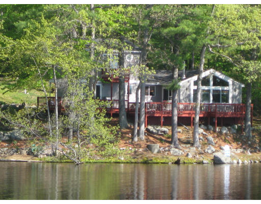 22 Holts Point Road Hampstead, NH 03841 - Photo 1 of 1 a view of houses with yard and lake view
