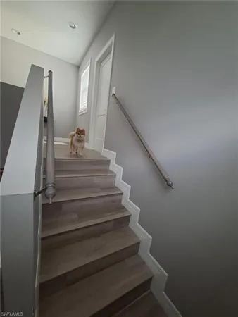 a bedroom with furniture and a chandelier
