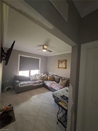 a bedroom with a bed and a table chair