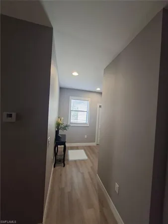 a view of yellow house with a yard