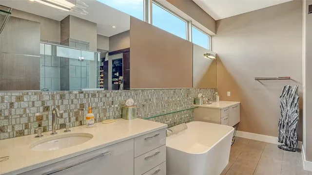 a bathroom with a bathtub and a sink