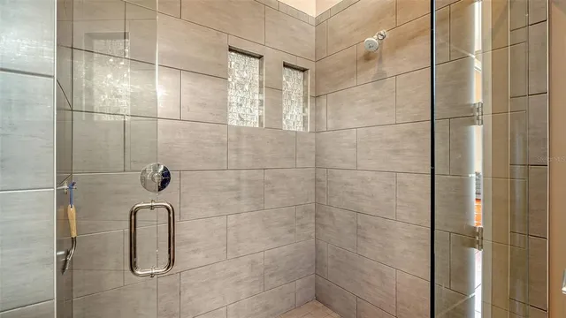 a room with wooden floor and windows