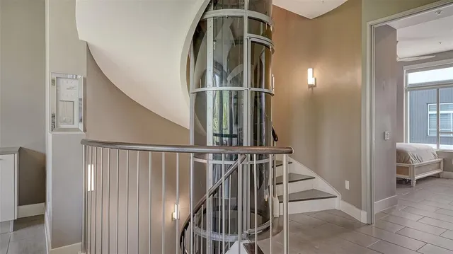 a bedroom with a bed and a window with the outer view