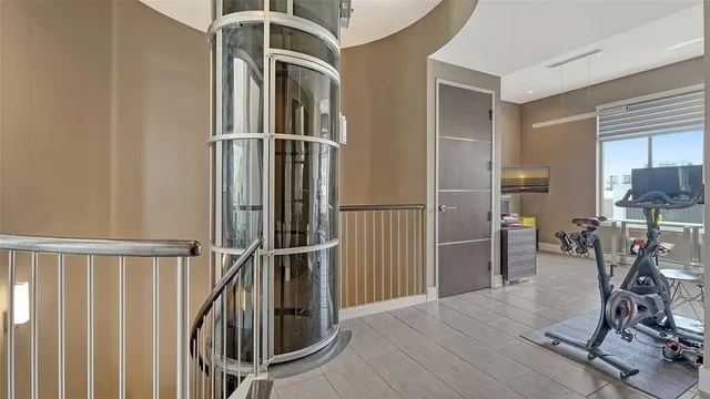 a bedroom with a bed and large window