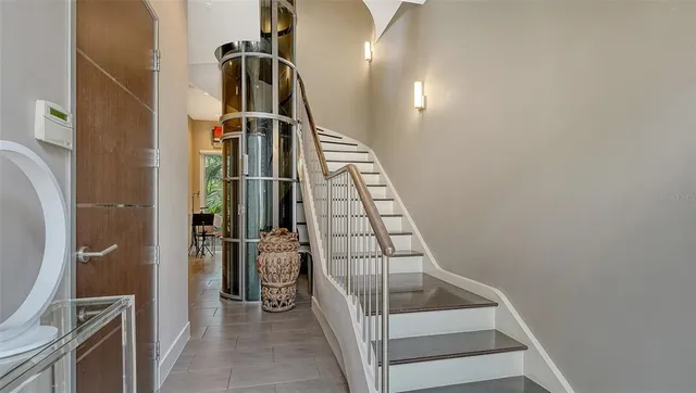 a view of stairs and utility room with stairs