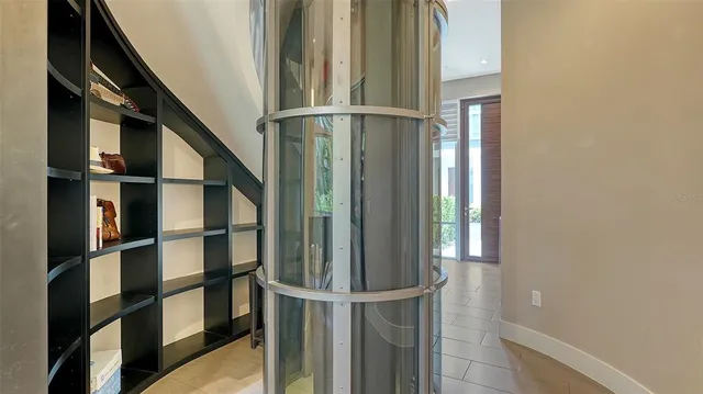 a view of staircase with railing and white walls