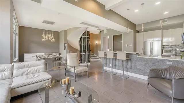 a bathroom with a granite countertop sink and a toilet