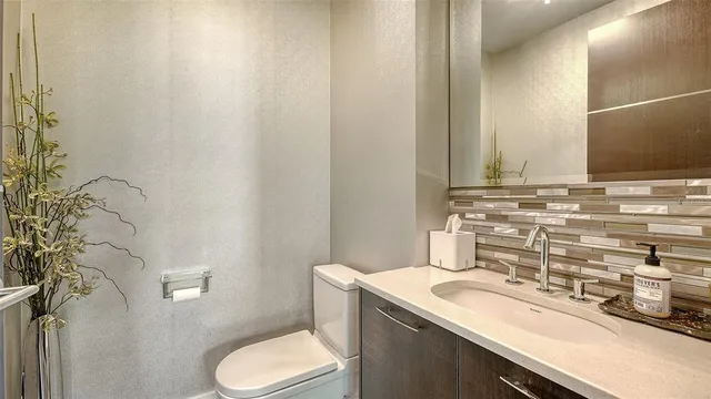 a bathroom with a sink a mirror and shower