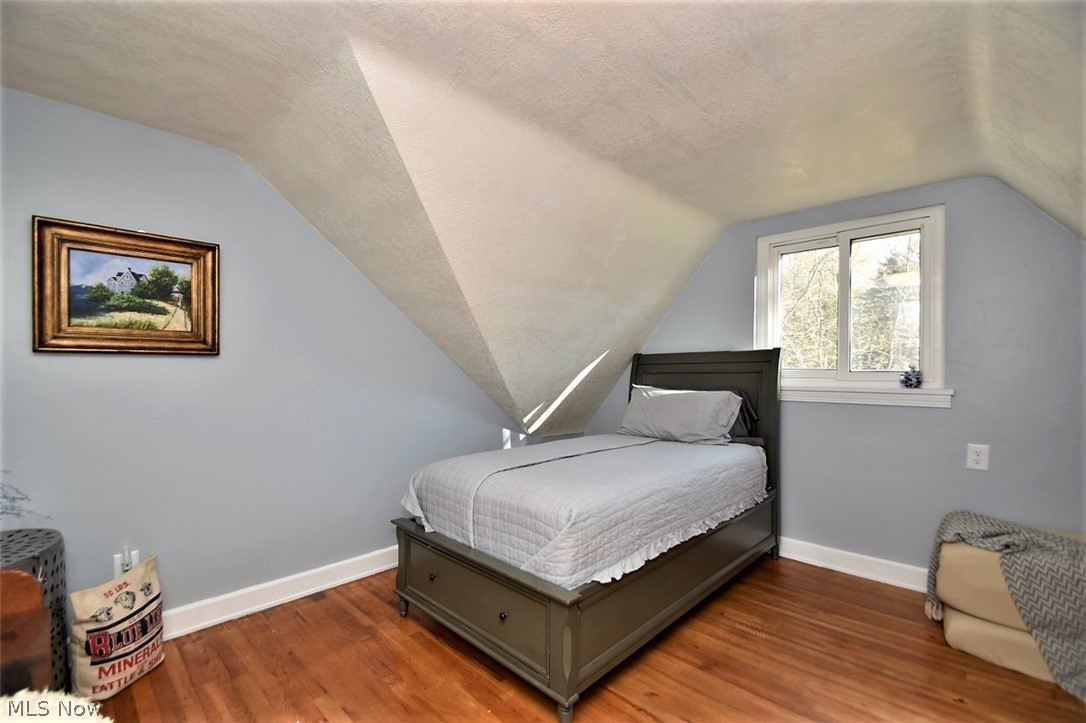 8790 Avery Road Broadview Heights, OH 44147 - Photo 22 of 35 The third bedroom upstairs also features original hardwood floors and angled walls.