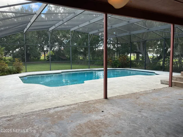 a view of a porch with a backyard