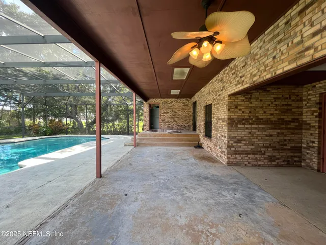 a view of a livingroom with furniture and staircase