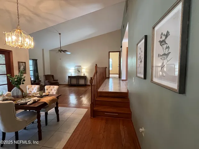 a kitchen with granite countertop a sink and stainless steel appliances