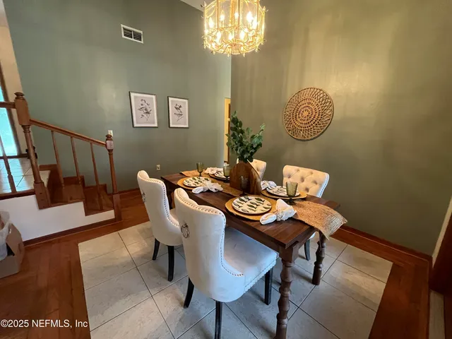 a kitchen with granite countertop stainless steel appliances a sink stove and refrigerator