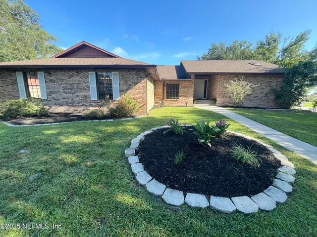 a house with swimming pool in front of it