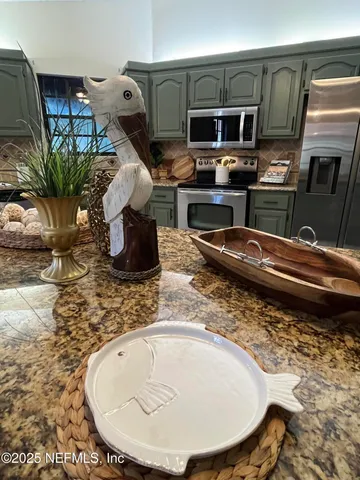 a large bathroom with a large tub and sink