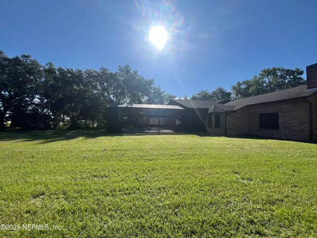 a view of a fountain is in the middle of a field