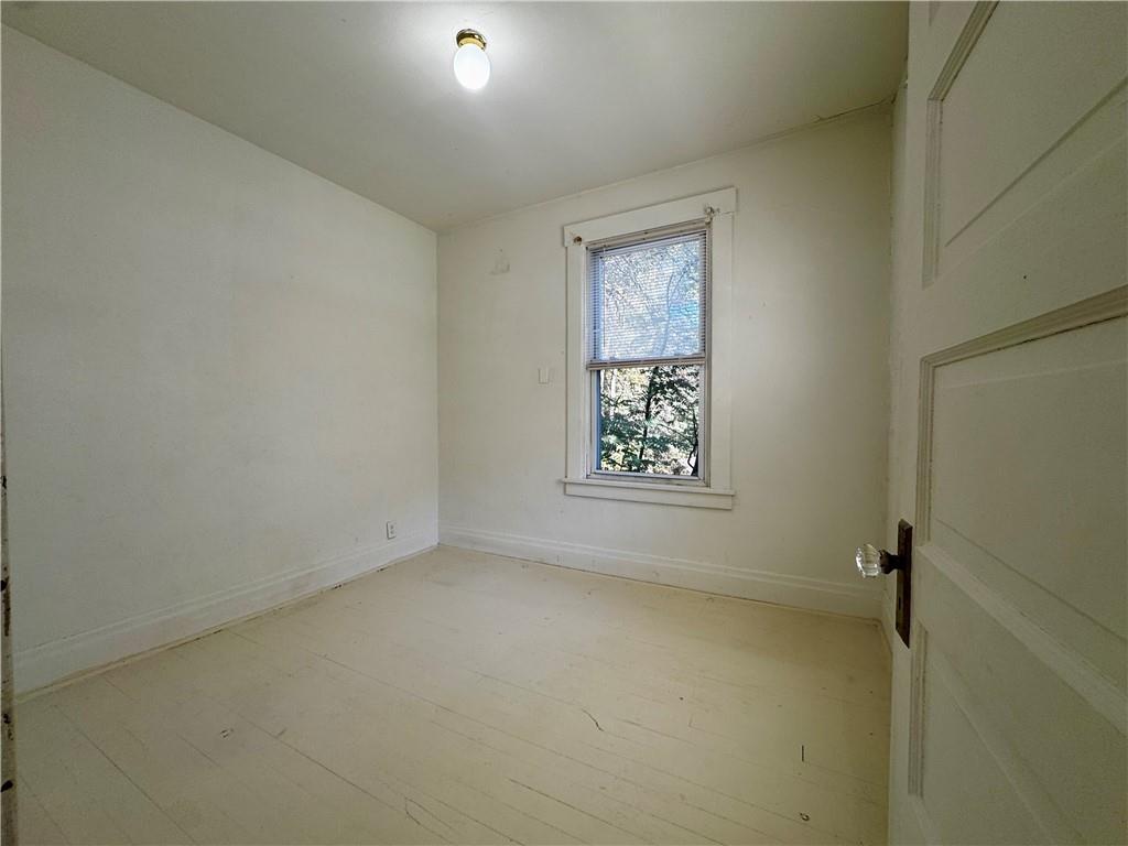 299 Stone Quarry Road Monaca, PA 15061 - Photo 11 of 27 an empty room with windows