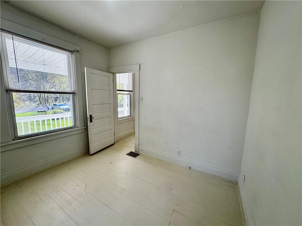 299 Stone Quarry Road Monaca, PA 15061 - Photo 12 of 27 an empty room with windows