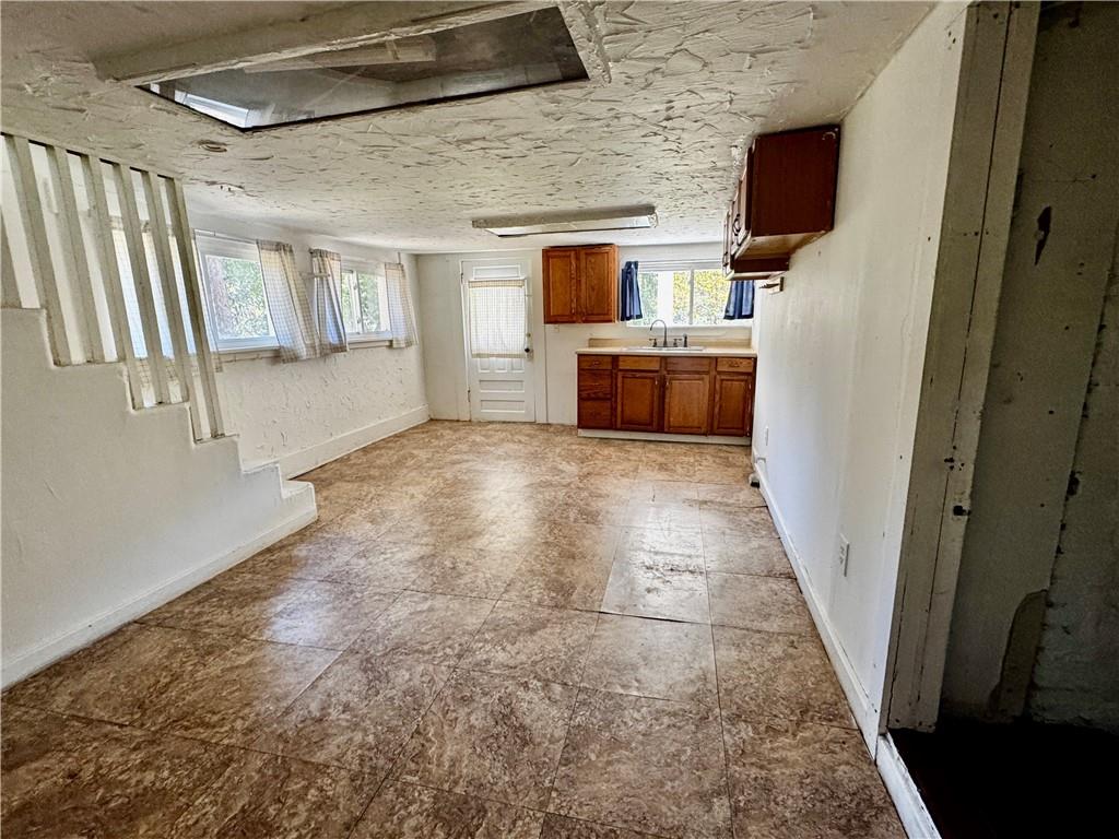 299 Stone Quarry Road Monaca, PA 15061 - Photo 15 of 27 a view of storage and utility room with washer and dryer