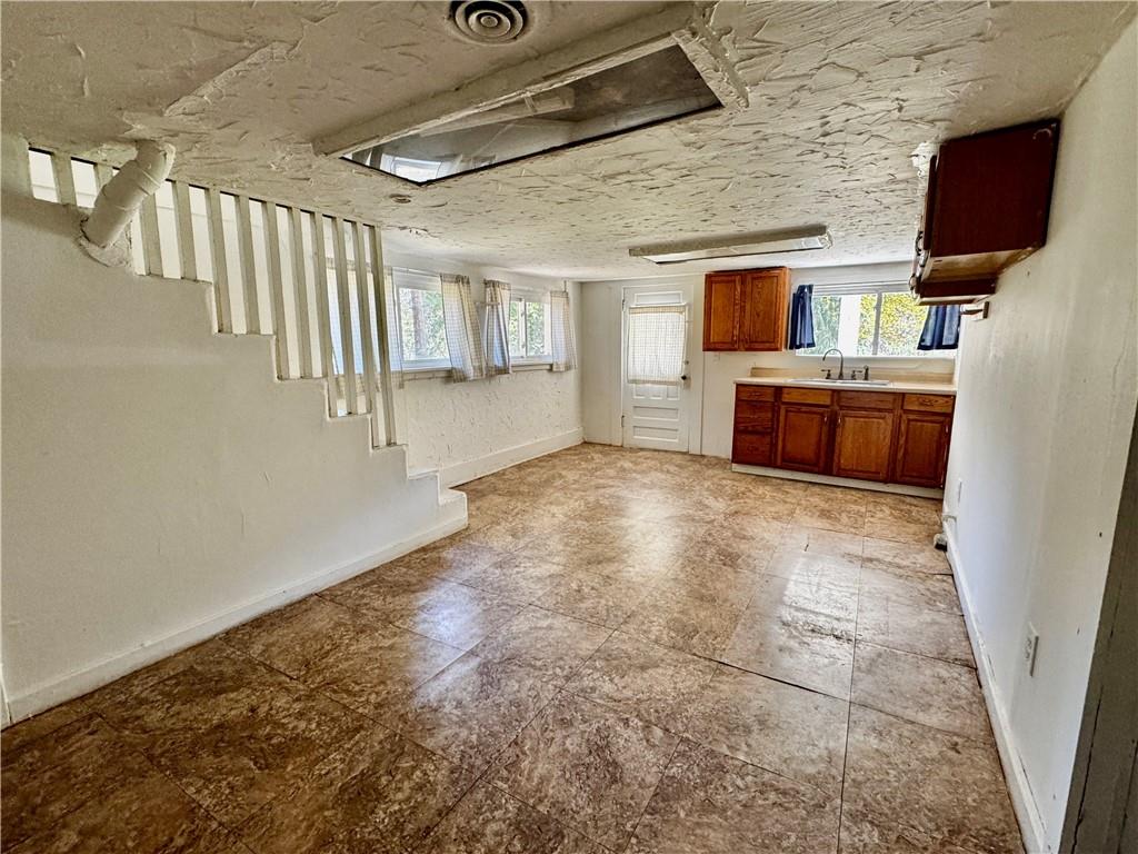 299 Stone Quarry Road Monaca, PA 15061 - Photo 16 of 27 a view of an empty room with a fireplace
