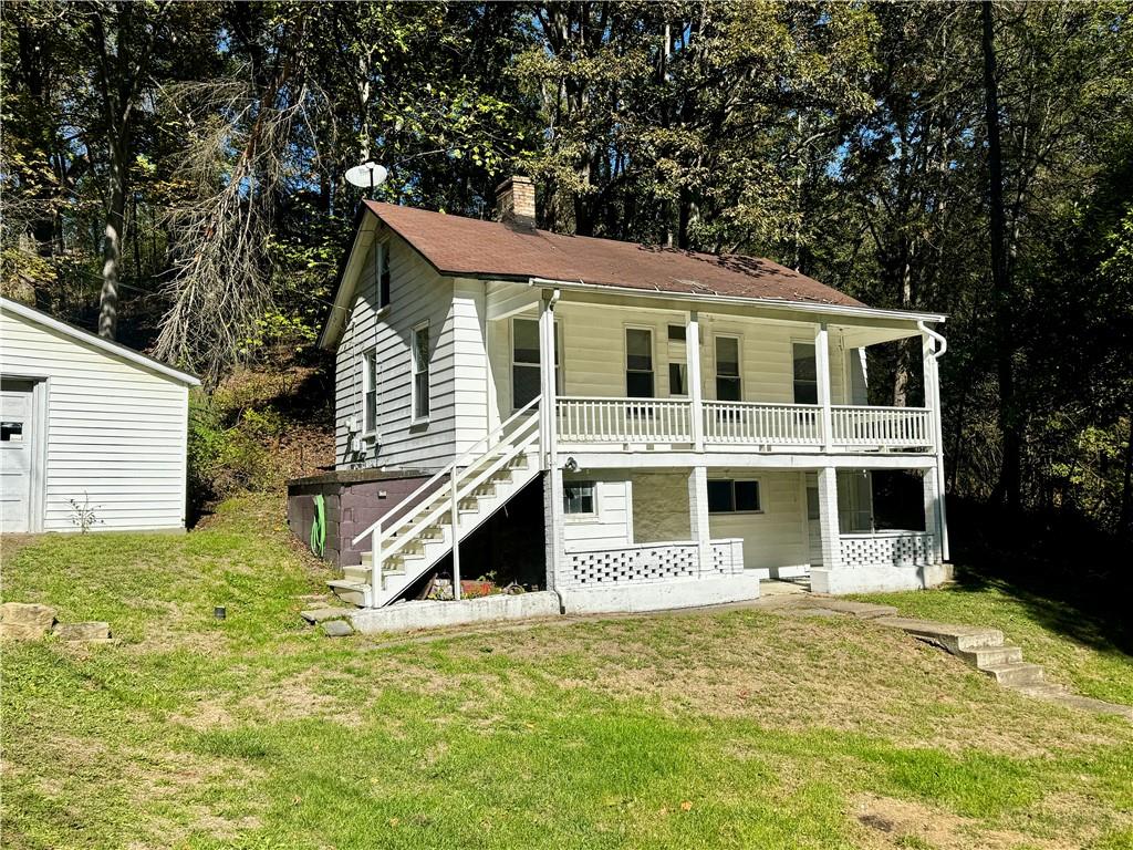 299 Stone Quarry Road Monaca, PA 15061 - Photo 2 of 27 a front view of a house with a yard
