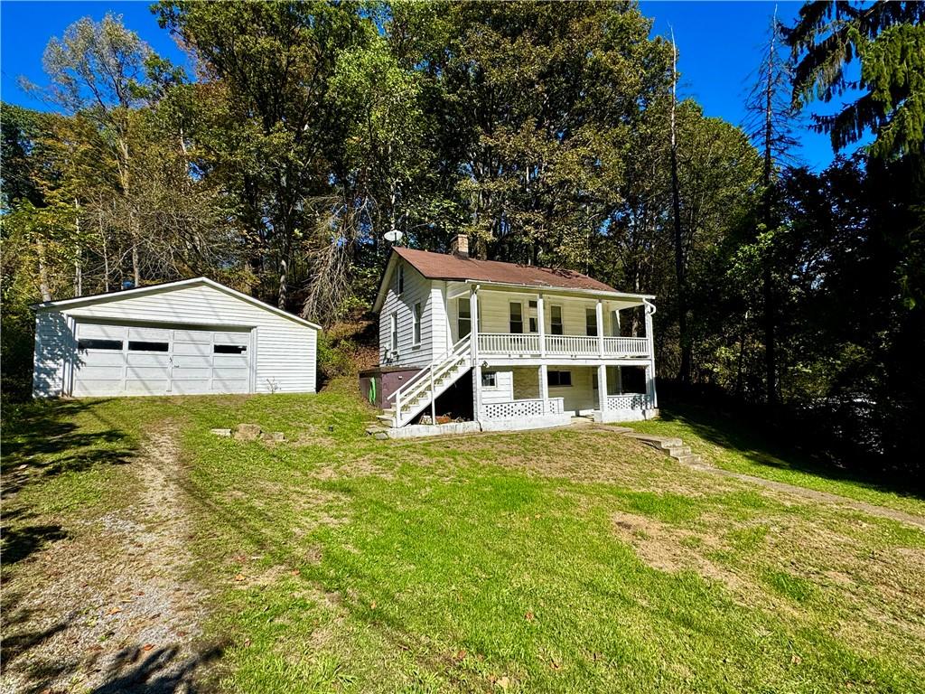 299 Stone Quarry Road Monaca, PA 15061 - Photo 25 of 27 a view of a house with a yard