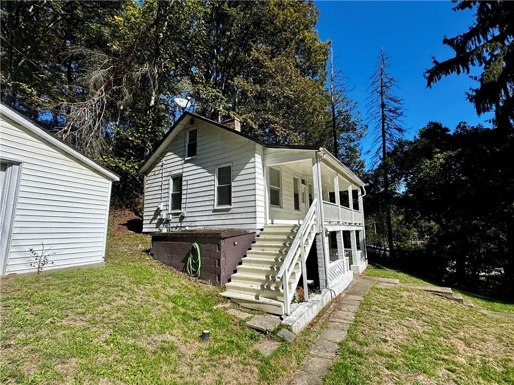 299 Stone Quarry Road Monaca, PA 15061 - Photo 26 of 27 a view of a house with a yard balcony and wooden fence
