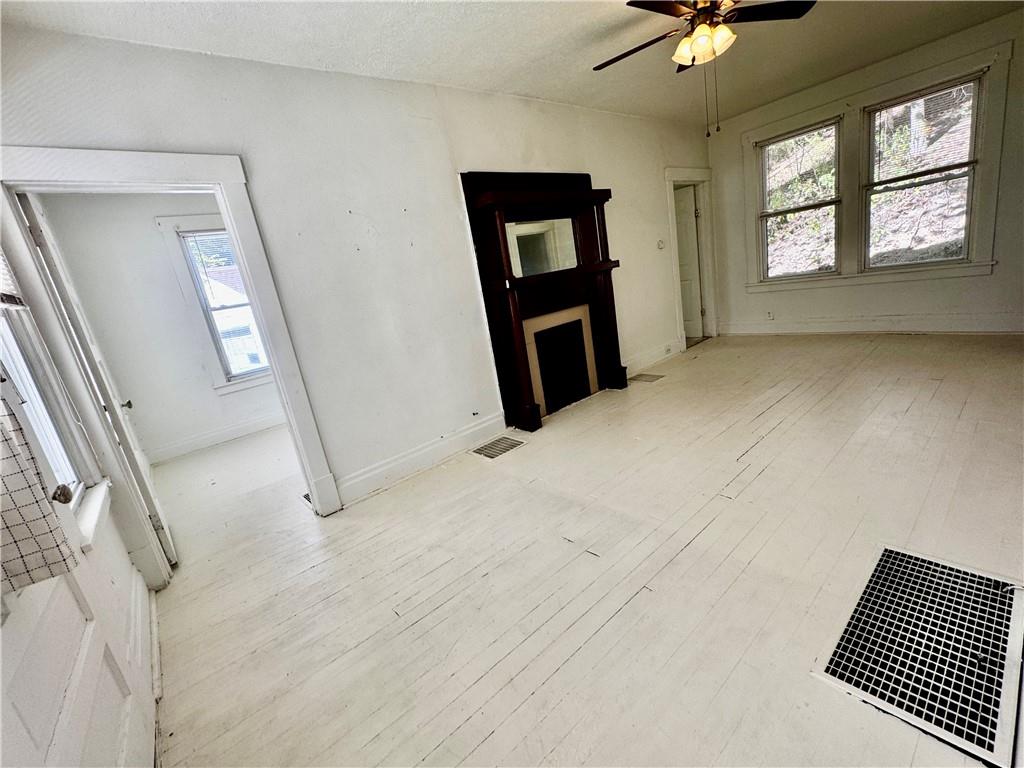 299 Stone Quarry Road Monaca, PA 15061 - Photo 8 of 27 a view of an empty room with a window