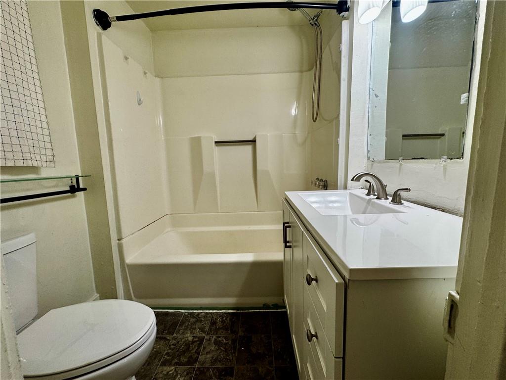 299 Stone Quarry Road Monaca, PA 15061 - Photo 9 of 27 a bathroom with a sink a toilet a mirror and bathtub