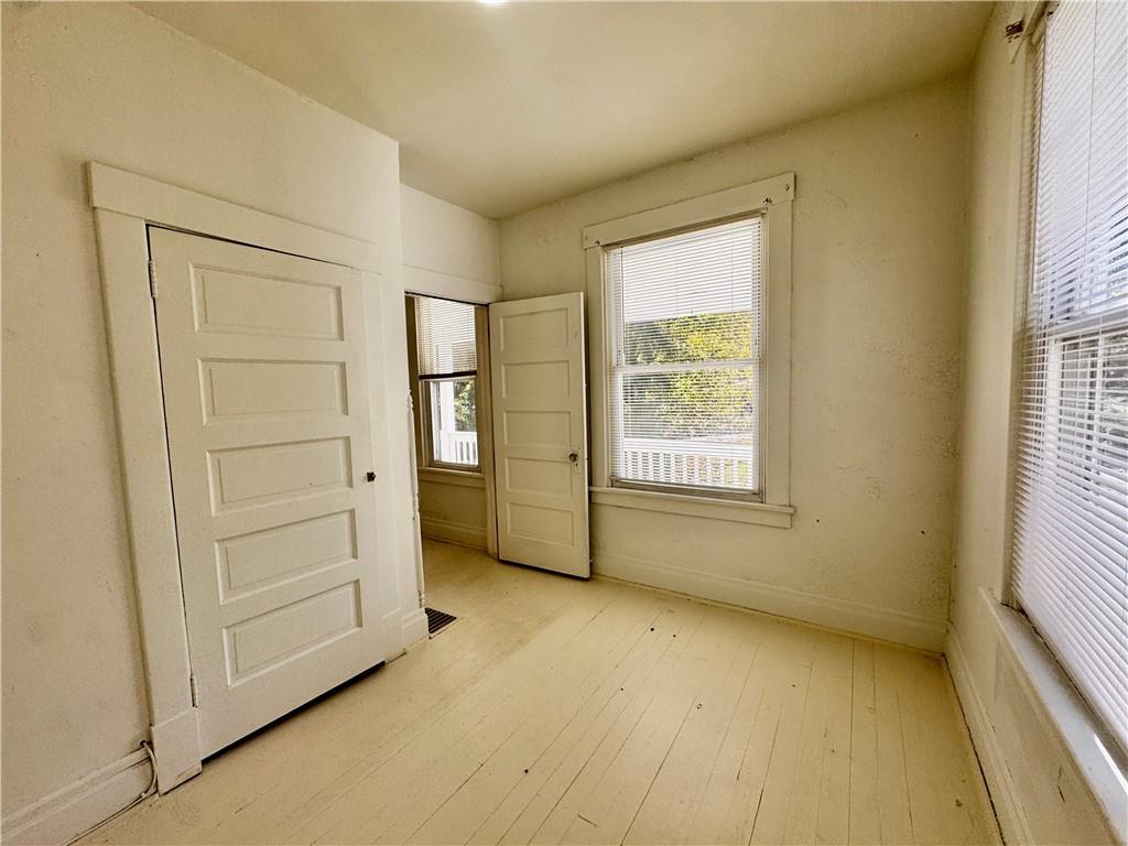 299 Stone Quarry Road Monaca, PA 15061 - Photo 10 of 27 a view of an empty room with a window
