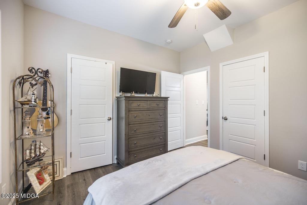 219 Diamond Place Gray, GA 31032 - Photo 24 of 42 a bedroom with a bed and a flat tv screen on dresser