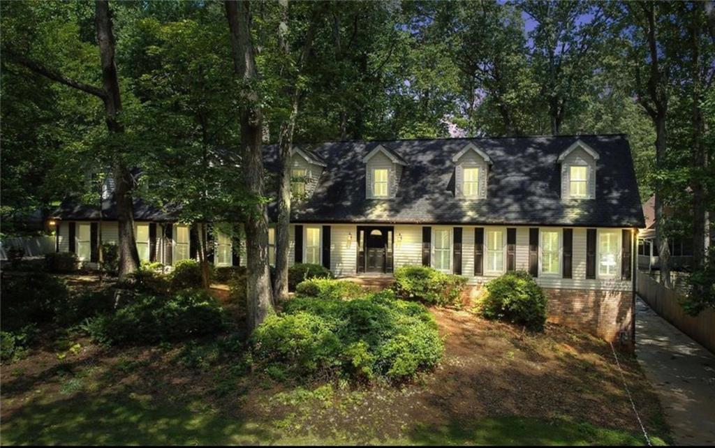 front view of a house with a garden