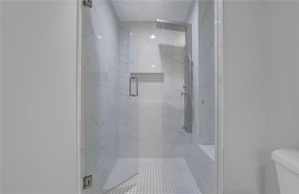 310 Clear Spring Court Marietta, GA 30068 - Photo 11 of 14 a bathroom with a shower