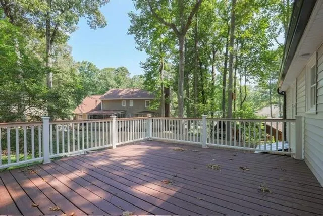 a view of deck with wooden floor and fence