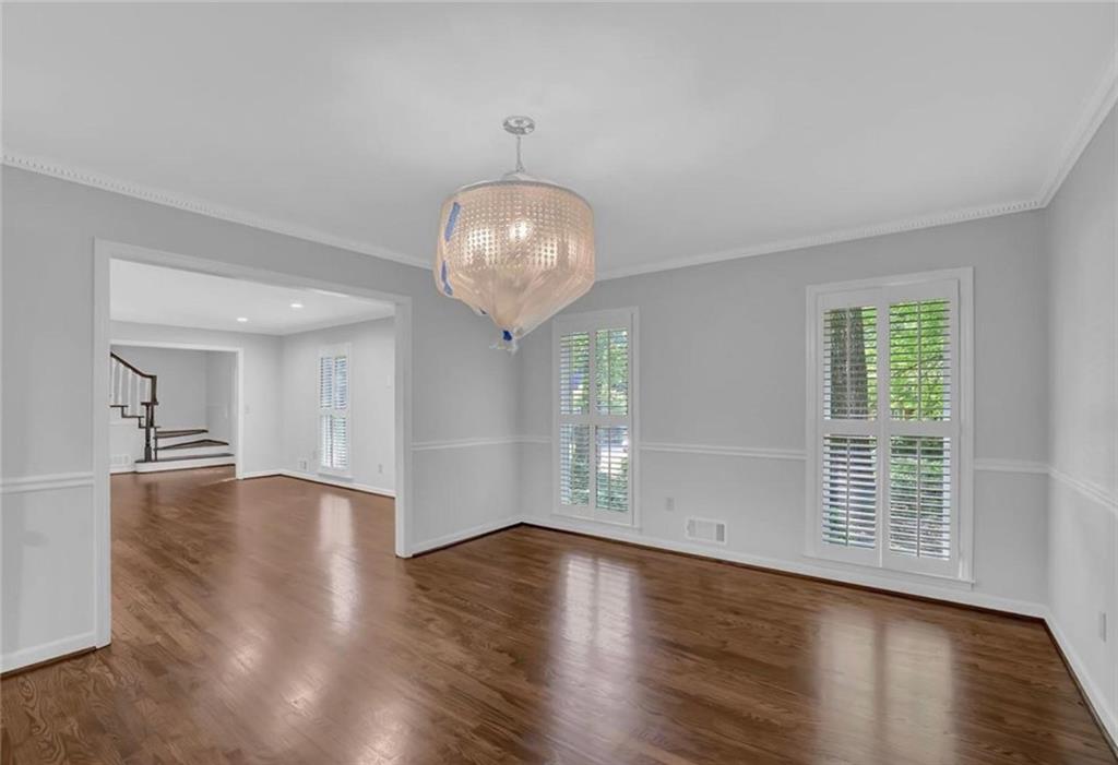 310 Clear Spring Court Marietta, GA 30068 - Photo 4 of 14 an empty room with wooden floor and windows