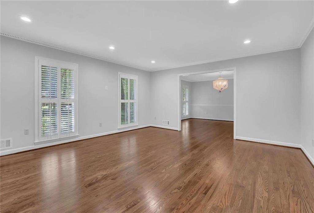 310 Clear Spring Court Marietta, GA 30068 - Photo 8 of 14 a view of an empty room with wooden floor and a window