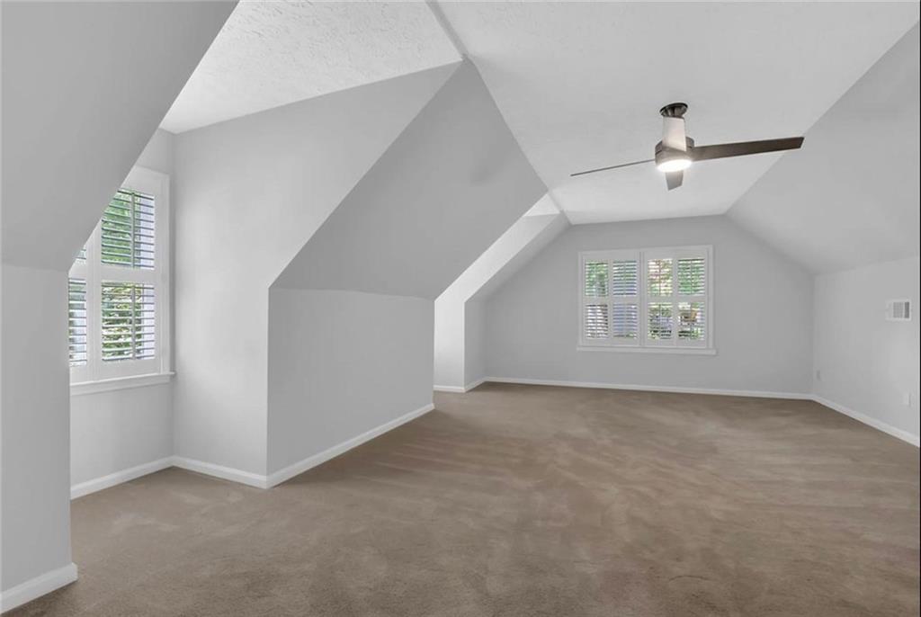 310 Clear Spring Court Marietta, GA 30068 - Photo 9 of 14 an empty room with windows