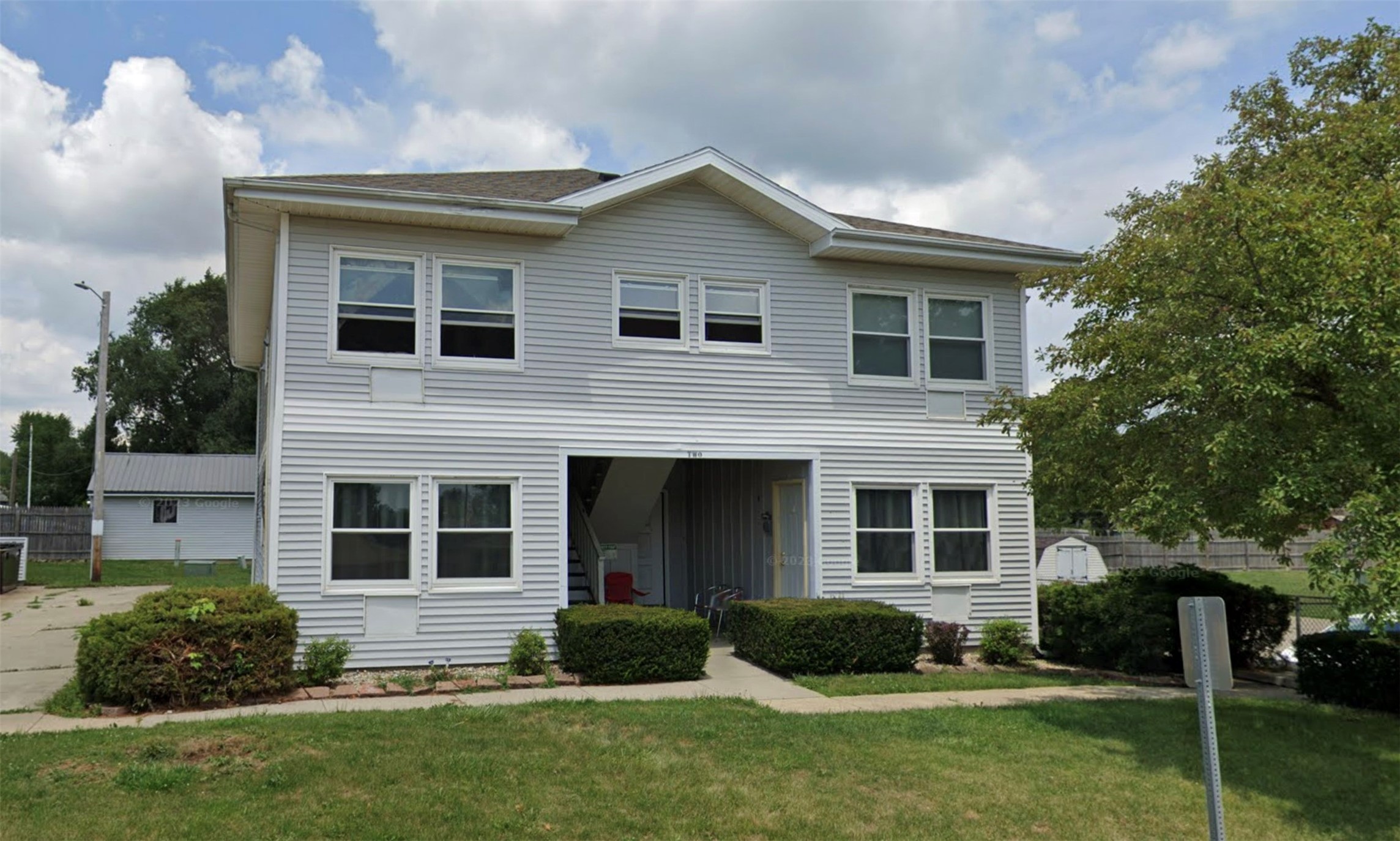 306 Wigwam Street Heyworth, IL 61745 - Photo 2 of 7 a view of a yard in front of a house