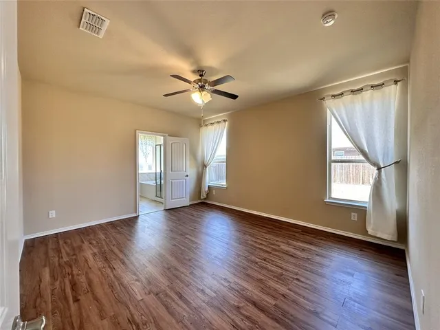 a view of kitchen with sink microwave and cabinets