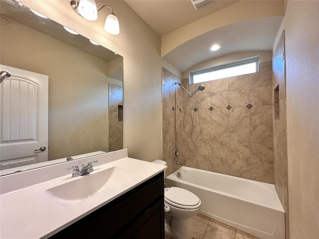 304 Cypress Crk Lane Denton, TX 76210 - Photo 16 of 24 a bathroom with a sink a toilet and shower