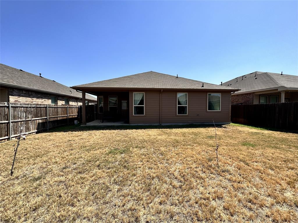 304 Cypress Crk Lane Denton, TX 76210 - Photo 19 of 24 a front view of a house with a yard