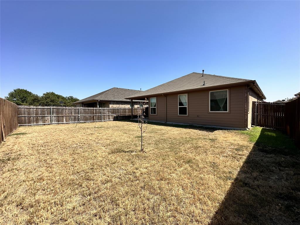 304 Cypress Crk Lane Denton, TX 76210 - Photo 22 of 24 a front view of a house with a yard