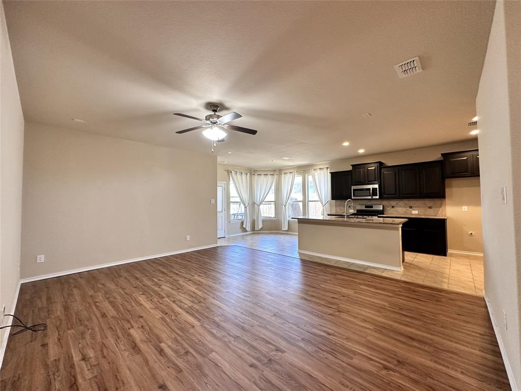 304 Cypress Crk Lane Denton, TX 76210 - Photo 8 of 24 a view of kitchen with sink microwave and cabinets