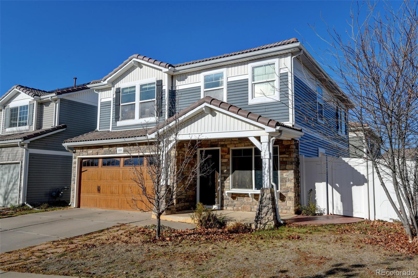 a view of a house with wooden floor and a barbeque